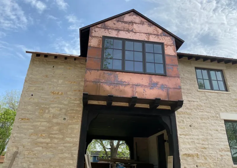 Copper metal panel facade on a stone building for Skylight Installation in Willows